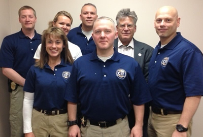 Left to right, front row: Officer Cindy Finch (Big Lake Police Dept.) Sgt. Kyle Wilson (Sherburne County Sheriff's Dept.) Sgt. Jason Lawson: (Becker Police Dept.). Middle row: Deputy Michele Vlasak (Sherburne County Sheriff's Dept.) Mark Anderson (Barbara Schneider Foundation). Back row: Detective Joe Gacke (Elk River Police Dept.) Sgt. Brian Boos (Elk River Police Dept.)
